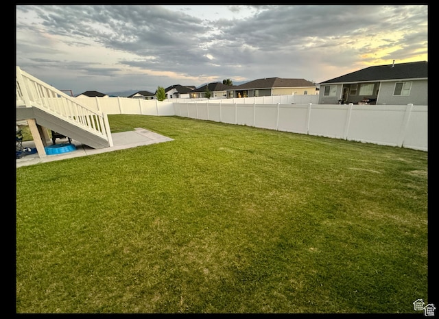 653 S 340 E, Smithfield, UT 84335 - view of yard with stairway, a patio area, and a residential view
