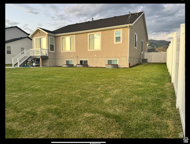 653 S 340 E, Smithfield, UT 84335 - back of house with stucco siding and central air condition unit