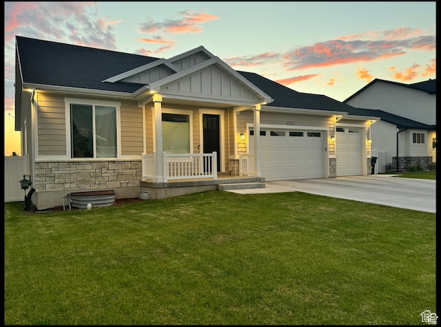 653 S 340 E, Smithfield, UT 84335 - craftsman inspired home with stone siding, covered porch, board and batten siding, a garage, and driveway