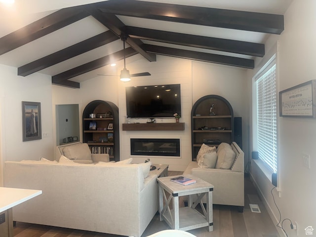 653 S 340 E, Smithfield, UT 84335 - living room featuring wood finished floors, a glass covered fireplace, healthy amount of natural light, and a ceiling fan