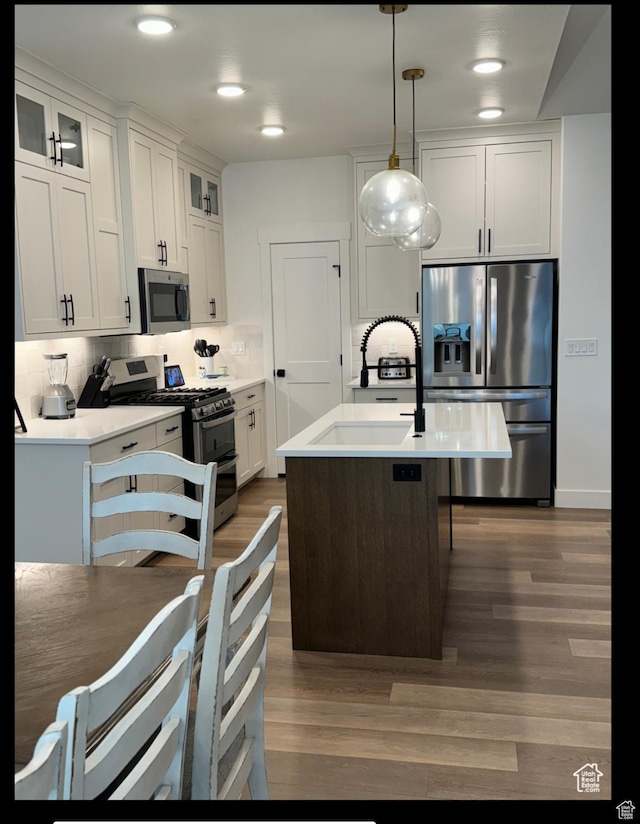 653 S 340 E, Smithfield, UT 84335 - kitchen featuring stainless steel appliances, dark wood-type flooring, glass insert cabinets, white cabinets, and recessed lighting
