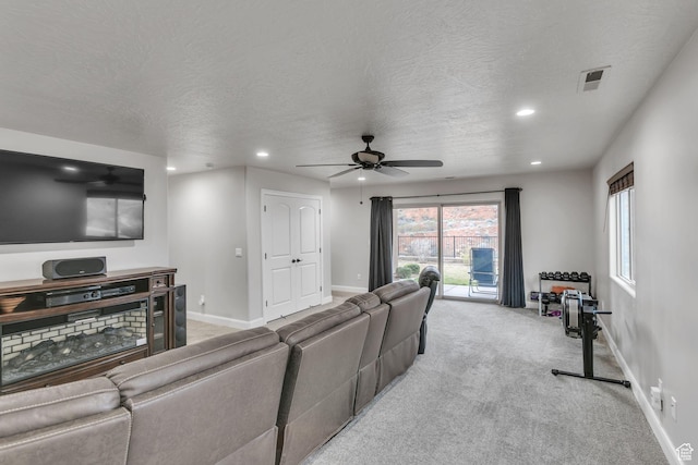 533 N Creek Ridge Cir, Washington, UT 84780 - living room with ceiling fan, recessed lighting, light carpet, baseboards, and a textured ceiling
