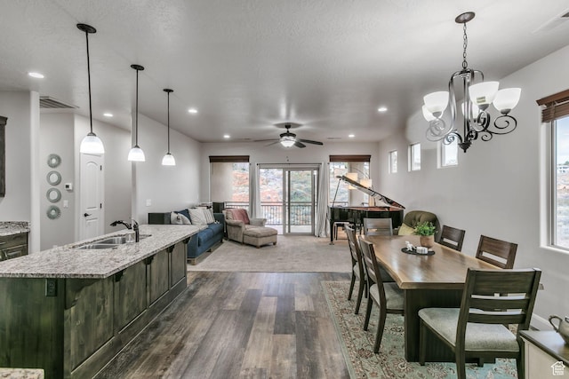 533 N Creek Ridge Cir, Washington, UT 84780 - dining space featuring dark wood-style flooring, recessed lighting, ceiling fan, and a chandelier
