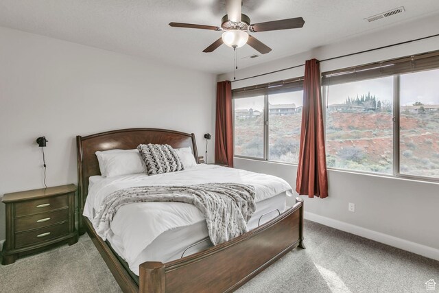 533 N Creek Ridge Cir, Washington, UT 84780 - bedroom featuring carpet, baseboards, and ceiling fan
