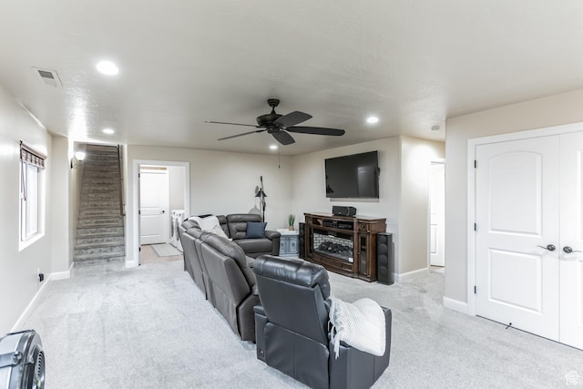 533 N Creek Ridge Cir, Washington, UT 84780 - living room featuring recessed lighting, light colored carpet, baseboards, a ceiling fan, and stairs