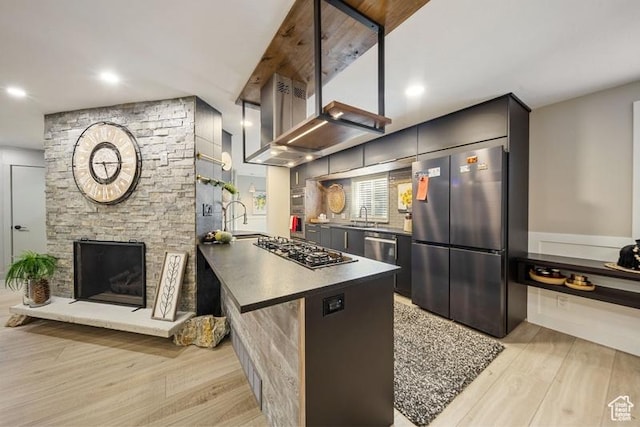 2341 E Neffs Ln S, Millcreek, UT 84109 - kitchen featuring freestanding refrigerator, gas cooktop, light wood-style flooring, a sink, and dark countertops