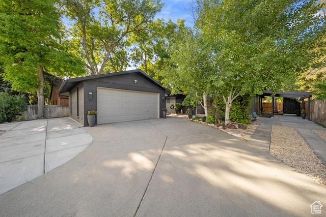 2341 E Neffs Ln S, Millcreek, UT 84109 - view of front of home featuring driveway, a garage, and brick siding
