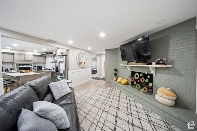 2341 E Neffs Ln S, Millcreek, UT 84109 - living room with light wood-style flooring, recessed lighting, and baseboards