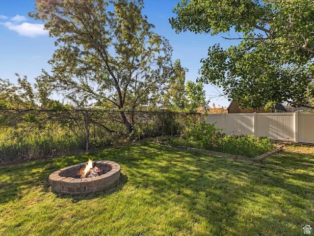 5986 S 4250 W, Roy, UT 84067 - view of yard featuring an outdoor fire pit