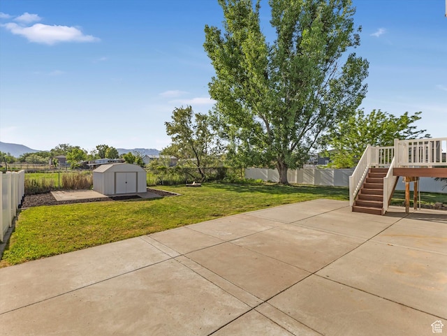 5986 S 4250 W, Roy, UT 84067 - view of yard featuring a patio, stairs, and a deck with mountain view