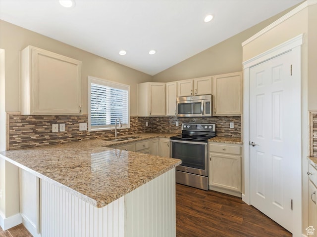 5986 S 4250 W, Roy, UT 84067 - kitchen featuring appliances with stainless steel finishes, a sink, a peninsula, dark wood-style flooring, and tasteful backsplash
