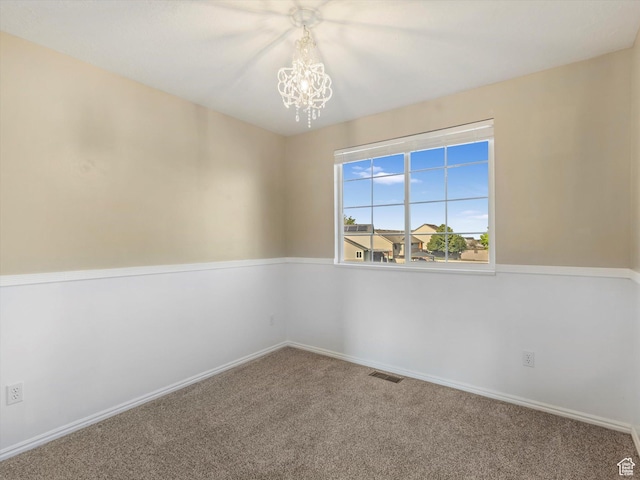 5986 S 4250 W, Roy, UT 84067 - carpeted empty room featuring a chandelier and baseboards
