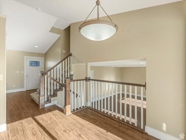 5986 S 4250 W, Roy, UT 84067 - stairway with wood finished floors, lofted ceiling, and baseboards