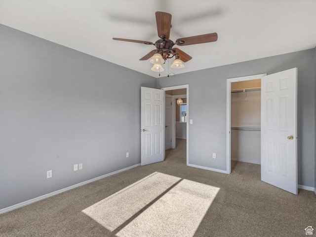 5986 S 4250 W, Roy, UT 84067 - unfurnished bedroom featuring carpet floors, baseboards, a closet, and a ceiling fan