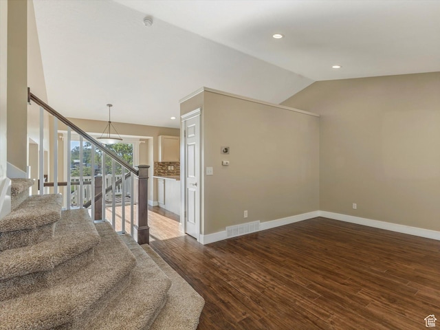 5986 S 4250 W, Roy, UT 84067 - stairway featuring wood finished floors, vaulted ceiling, baseboards, and recessed lighting