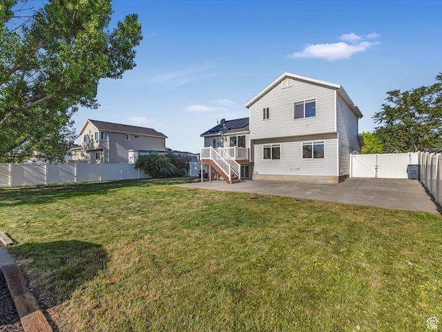 5986 S 4250 W, Roy, UT 84067 - rear view of property with a patio, stairs, and a gate