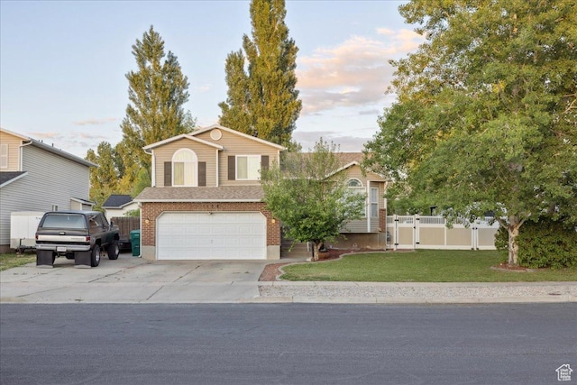 1158 N 2675 W, Layton, UT 84041 - view of front of home featuring an attached garage, concrete driveway, and a gate