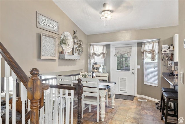 1158 N 2675 W, Layton, UT 84041 - dining space featuring plenty of natural light, baseboards, stone finish floors, and stairs