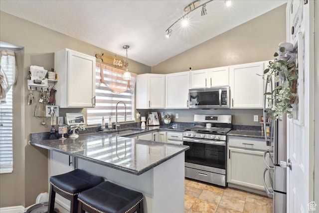 1158 N 2675 W, Layton, UT 84041 - kitchen featuring stainless steel appliances, a sink, lofted ceiling, a peninsula, and white cabinets