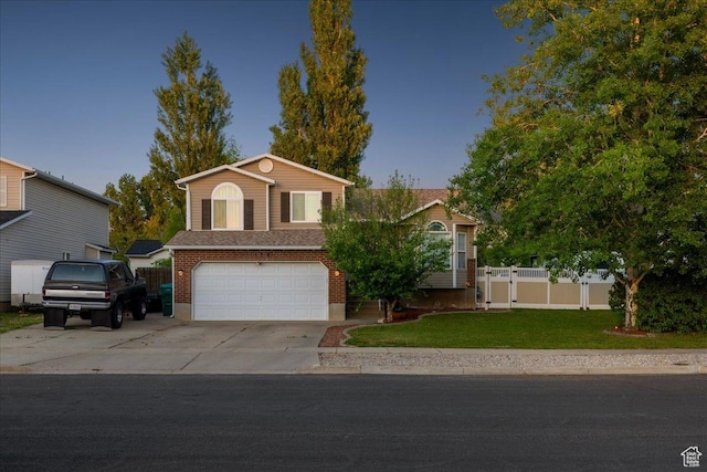 1158 N 2675 W, Layton, UT 84041 - view of front facade with a garage, concrete driveway, and brick siding
