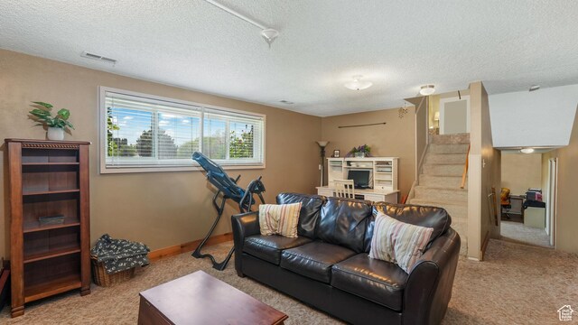1253 Nathaniel Dr E, Pleasant Grove, UT 84062 - living room featuring light carpet, stairway, a textured ceiling, and baseboards