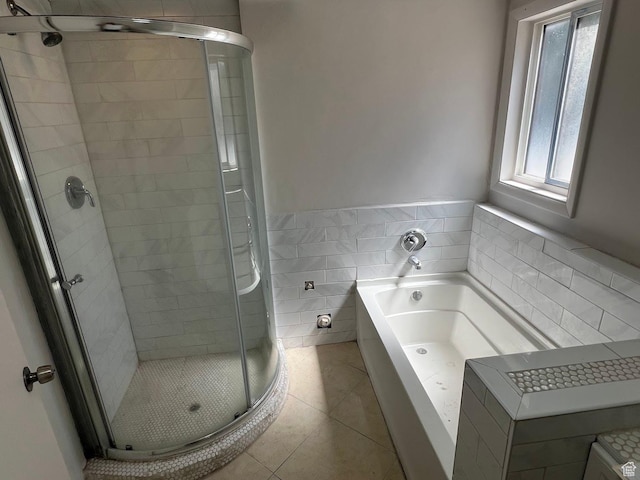 3722 S 8235 W, Magna, UT 84044 - bathroom with a stall shower, tile walls, a garden tub, tile patterned flooring, and wainscoting