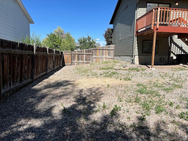 3722 S 8235 W, Magna, UT 84044 - view of yard with a wooden deck, central AC unit, and stairway