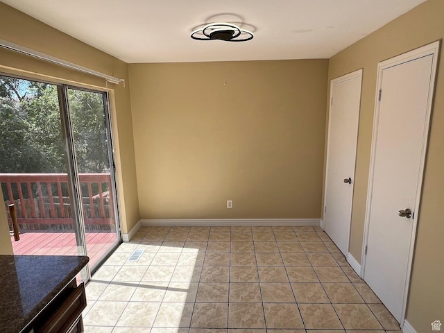3722 S 8235 W, Magna, UT 84044 - unfurnished dining area with light tile patterned floors and baseboards