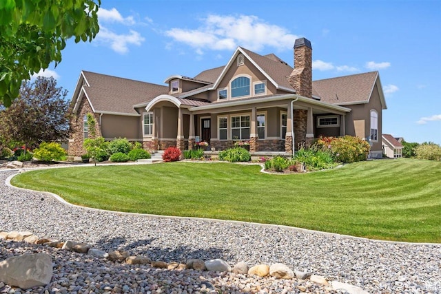1097 E Highline Rd, Lake Point, UT 84074 - craftsman inspired home with stucco siding, stone siding, a chimney, and a front lawn