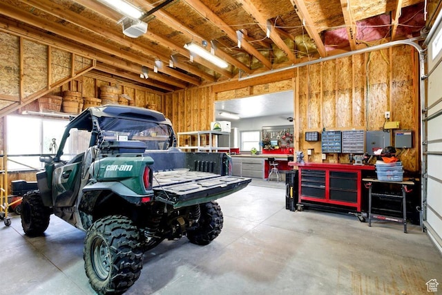 1097 E Highline Rd, Lake Point, UT 84074 - garage featuring a workshop area and a garage door opener
