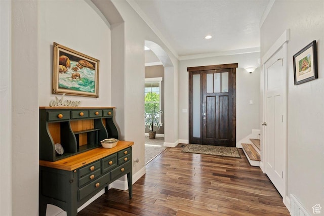 1097 E Highline Rd, Lake Point, UT 84074 - entryway with arched walkways, dark wood finished floors, baseboards, and recessed lighting