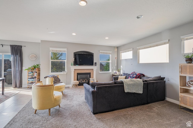 2869 W Chestnut St, Lehi, UT 84043 - living room featuring plenty of natural light, a glass covered fireplace, recessed lighting, and baseboards