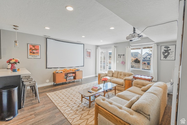 2869 W Chestnut St, Lehi, UT 84043 - home theater room featuring a textured ceiling, wood finished floors, recessed lighting, and baseboards