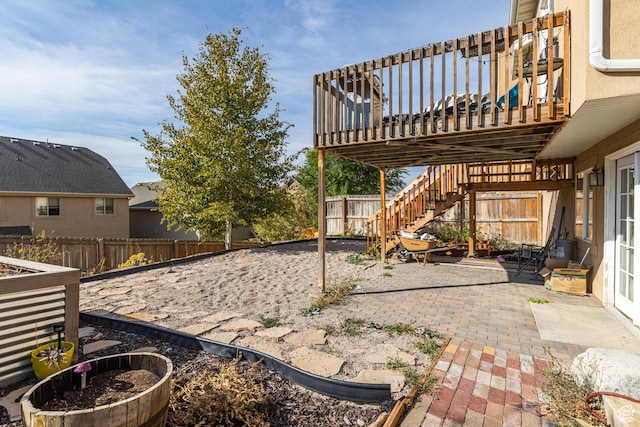 2869 W Chestnut St, Lehi, UT 84043 - fenced backyard featuring a patio area, stairs, and a deck