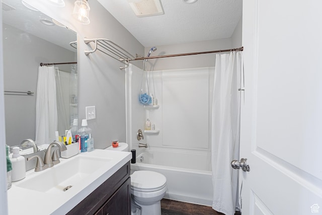 2869 W Chestnut St, Lehi, UT 84043 - bathroom with vanity, shower / bath combo, toilet, wood finished floors, and a textured ceiling