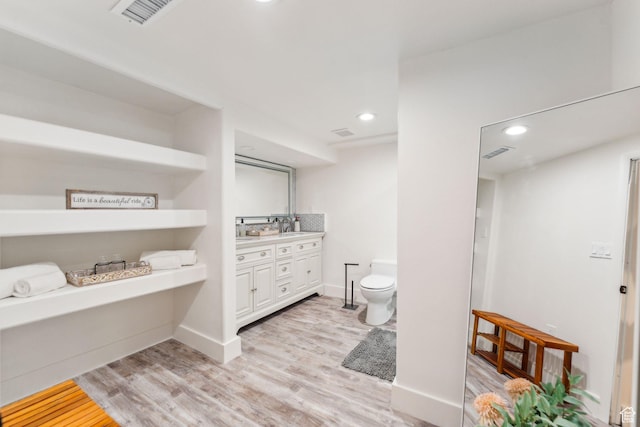 2578 E 2940 S, Salt Lake City, UT 84109 - full bathroom with vanity, wood finished floors, toilet, recessed lighting, and baseboards