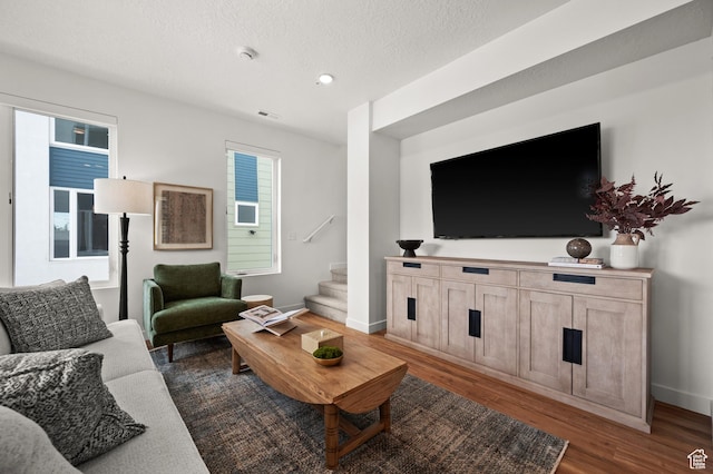 1034 W 1700 S Unit 121, Salt Lake City, UT 84104 - living area featuring stairway, dark wood finished floors, baseboards, recessed lighting, and a textured ceiling