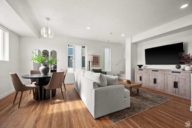 1034 W 1700 S Unit 121, Salt Lake City, UT 84104 - living area with stairs, light wood-style flooring, healthy amount of natural light, a textured ceiling, and recessed lighting