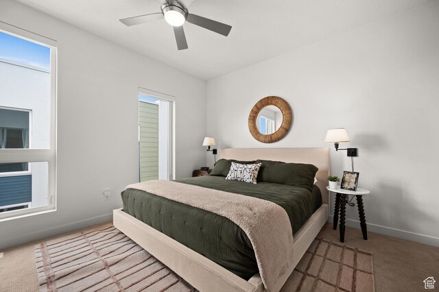 1034 W 1700 S Unit 121, Salt Lake City, UT 84104 - bedroom with carpet, baseboards, and ceiling fan