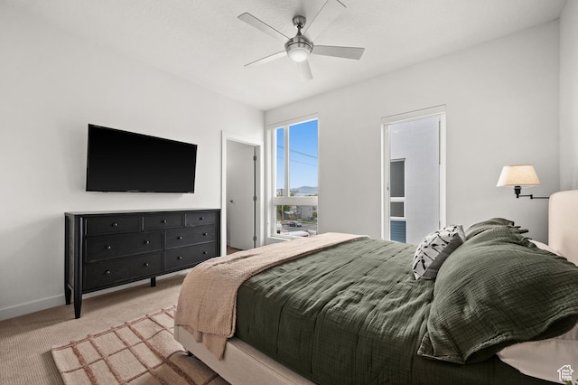 1034 W 1700 S Unit 121, Salt Lake City, UT 84104 - bedroom featuring carpet, baseboards, and a ceiling fan