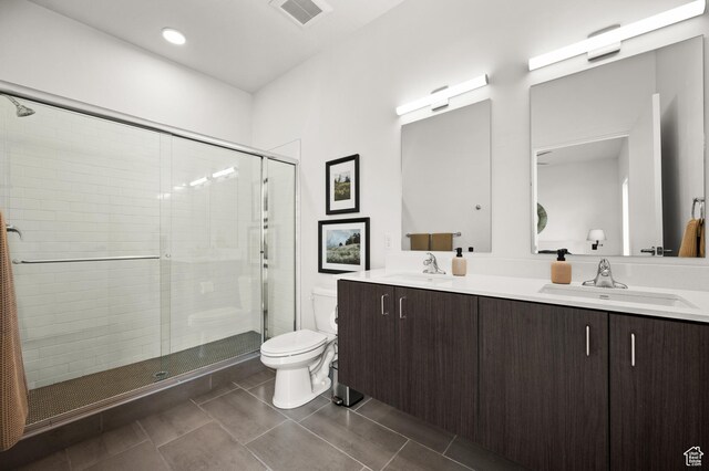 1034 W 1700 S Unit 121, Salt Lake City, UT 84104 - bathroom with toilet, double vanity, a stall shower, and tile patterned floors