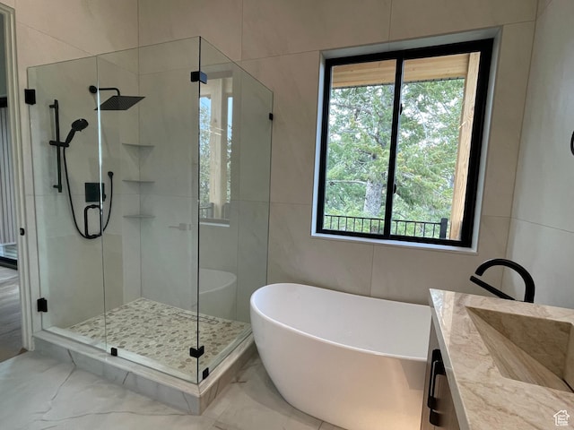 101 Crestview Cir, Park City, UT 84098 - bathroom featuring plenty of natural light, a soaking tub, a stall shower, and marble look tiles