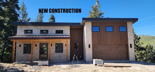 101 Crestview Cir, Park City, UT 84098 - modern home featuring a standing seam roof, stone siding, and metal roof