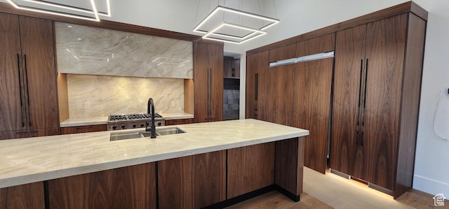 101 Crestview Cir, Park City, UT 84098 - kitchen with decorative backsplash, a sink, and light wood finished floors