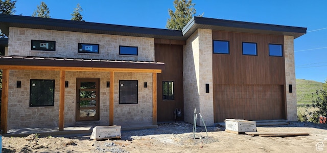 101 Crestview Cir, Park City, UT 84098 - view of front of house featuring a standing seam roof, stone siding, and metal roof