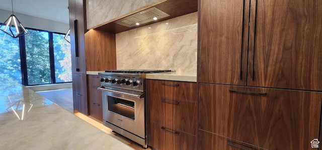 101 Crestview Cir, Park City, UT 84098 - kitchen with high end stove, light countertops, modern cabinets, premium range hood, and tasteful backsplash