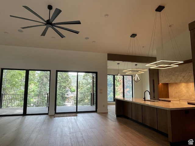 101 Crestview Cir, Park City, UT 84098 - kitchen featuring open floor plan, a sink, wood finished floors, a large island, and modern cabinets