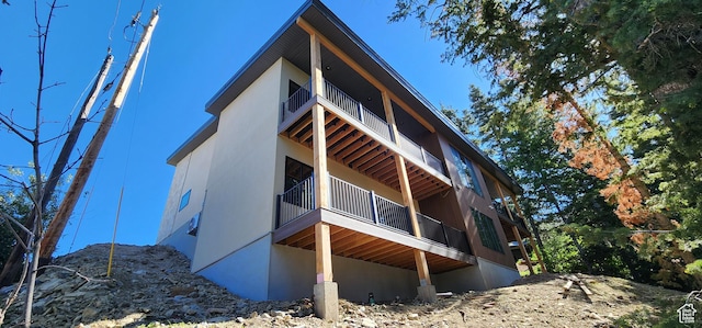 101 Crestview Cir, Park City, UT 84098 - view of home's exterior with a balcony and stucco siding