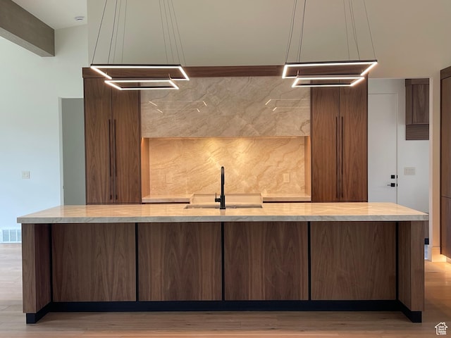 101 Crestview Cir, Park City, UT 84098 - bar featuring a sink, light wood-style flooring, and backsplash