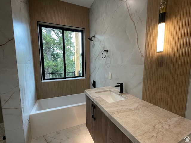 101 Crestview Cir, Park City, UT 84098 - full bathroom with marble finish flooring, healthy amount of natural light, a bath, vanity, and tile walls